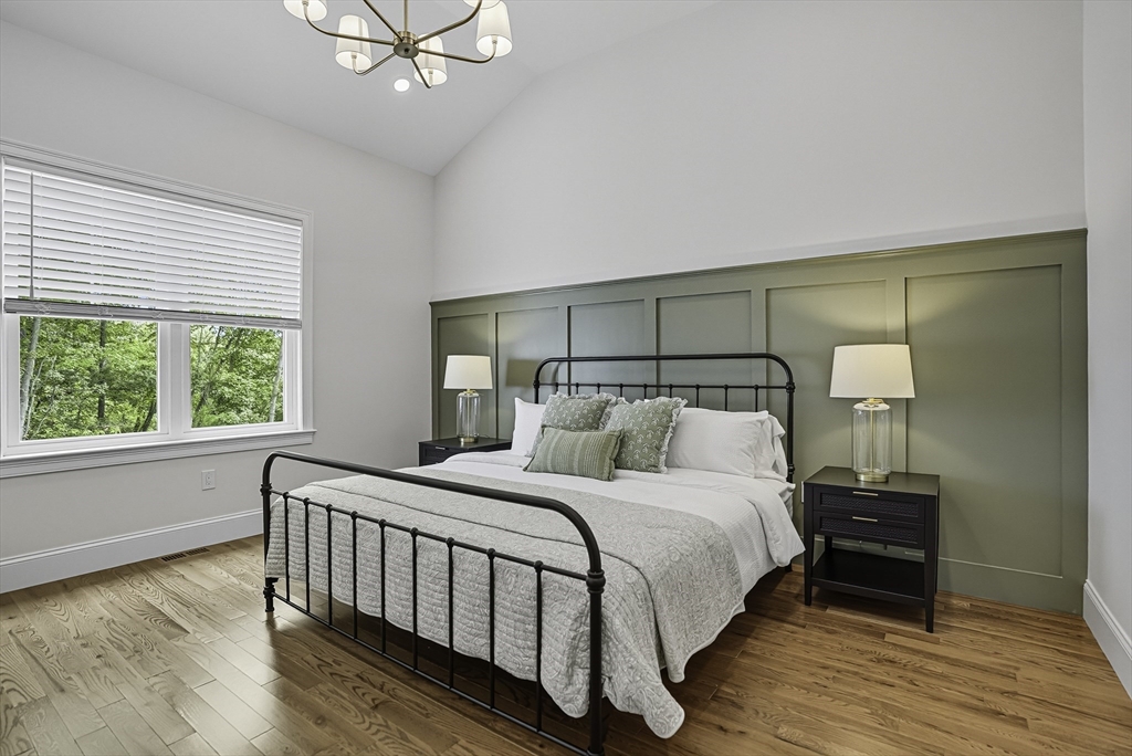 7 Waterville Lane, Unit 7 Hopkinton, MA 01748 - Photo 12 of 31 a bedroom with a bed and a window