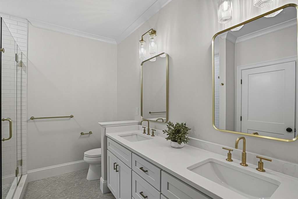 7 Waterville Lane, Unit 7 Hopkinton, MA 01748 - Photo 13 of 31 a bathroom with 2 sink toilet and a mirror