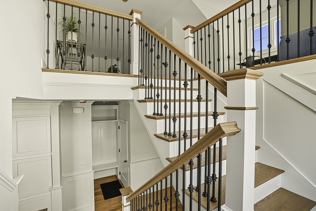 7 Waterville Lane, Unit 7 Hopkinton, MA 01748 - Photo 15 of 31 a view of staircase with railing and white walls