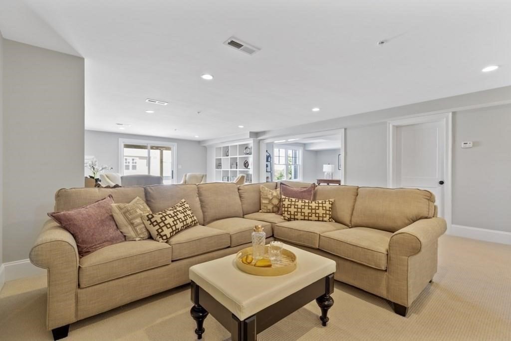 7 Waterville Lane, Unit 7 Hopkinton, MA 01748 - Photo 20 of 31 a living room with furniture and a couch