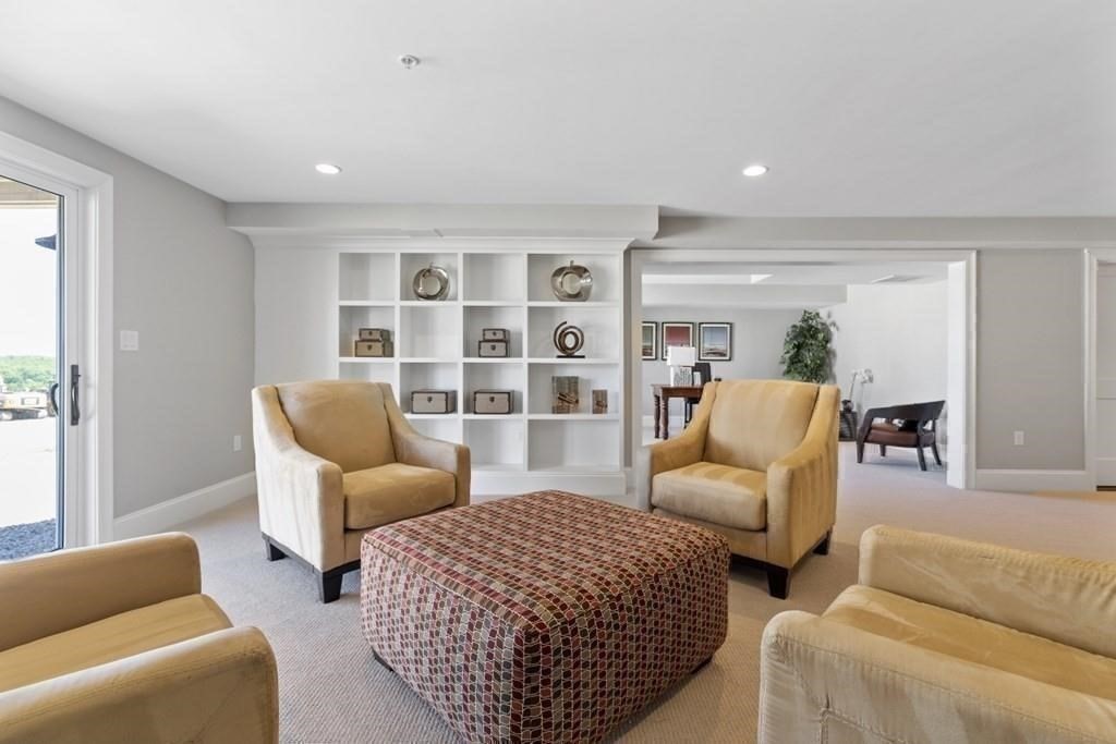 7 Waterville Lane, Unit 7 Hopkinton, MA 01748 - Photo 21 of 31 a living room with furniture
