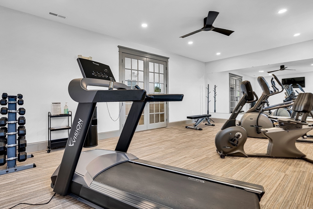 7 Waterville Lane, Unit 7 Hopkinton, MA 01748 - Photo 26 of 31 a view of a room with gym equipment