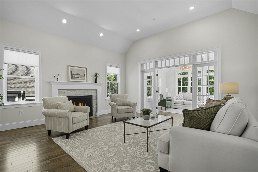7 Waterville Lane, Unit 7 Hopkinton, MA 01748 - Photo 10 of 31 a living room with furniture and a fireplace