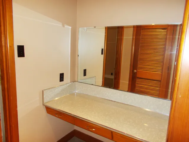 a bathroom with a sink a bathtub and a mirror