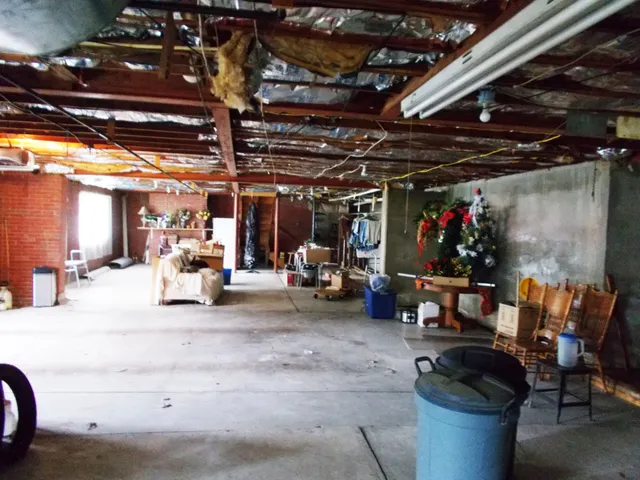 a aerial view of a house with a big yard and large trees
