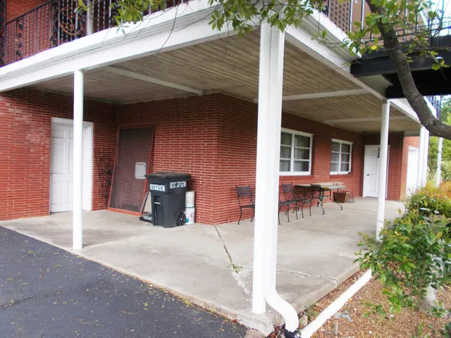 a view of a porch with wooden floor and outdoor space