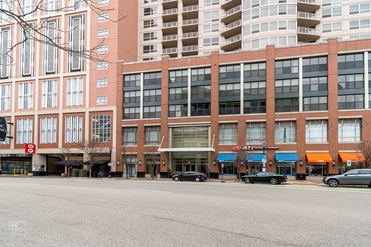 807 Davis Street, Unit 1007 Evanston, IL 60201 - Photo 2 of 14 a car parked in front of a building