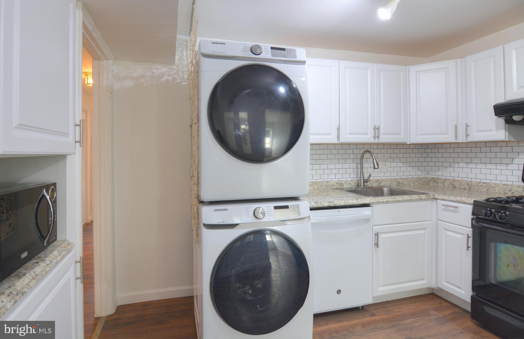 18905 Smoothstone Way, Unit I3 Gaithersburg, MD 20886 - Photo 20 of 32 a utility room with sink dryer and washer