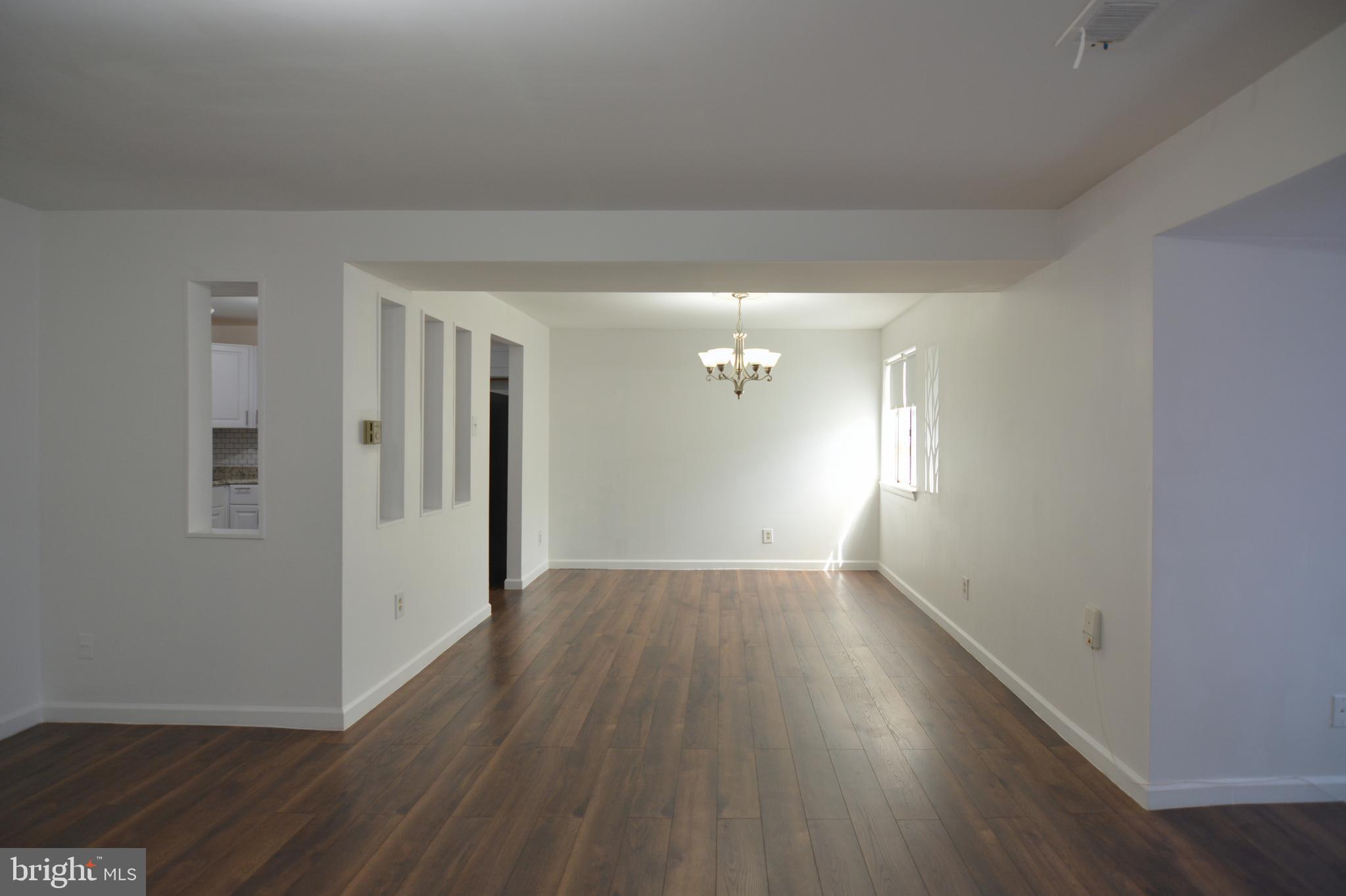 18905 Smoothstone Way, Unit I3 Gaithersburg, MD 20886 - Photo 10 of 32 a view of an empty room and window