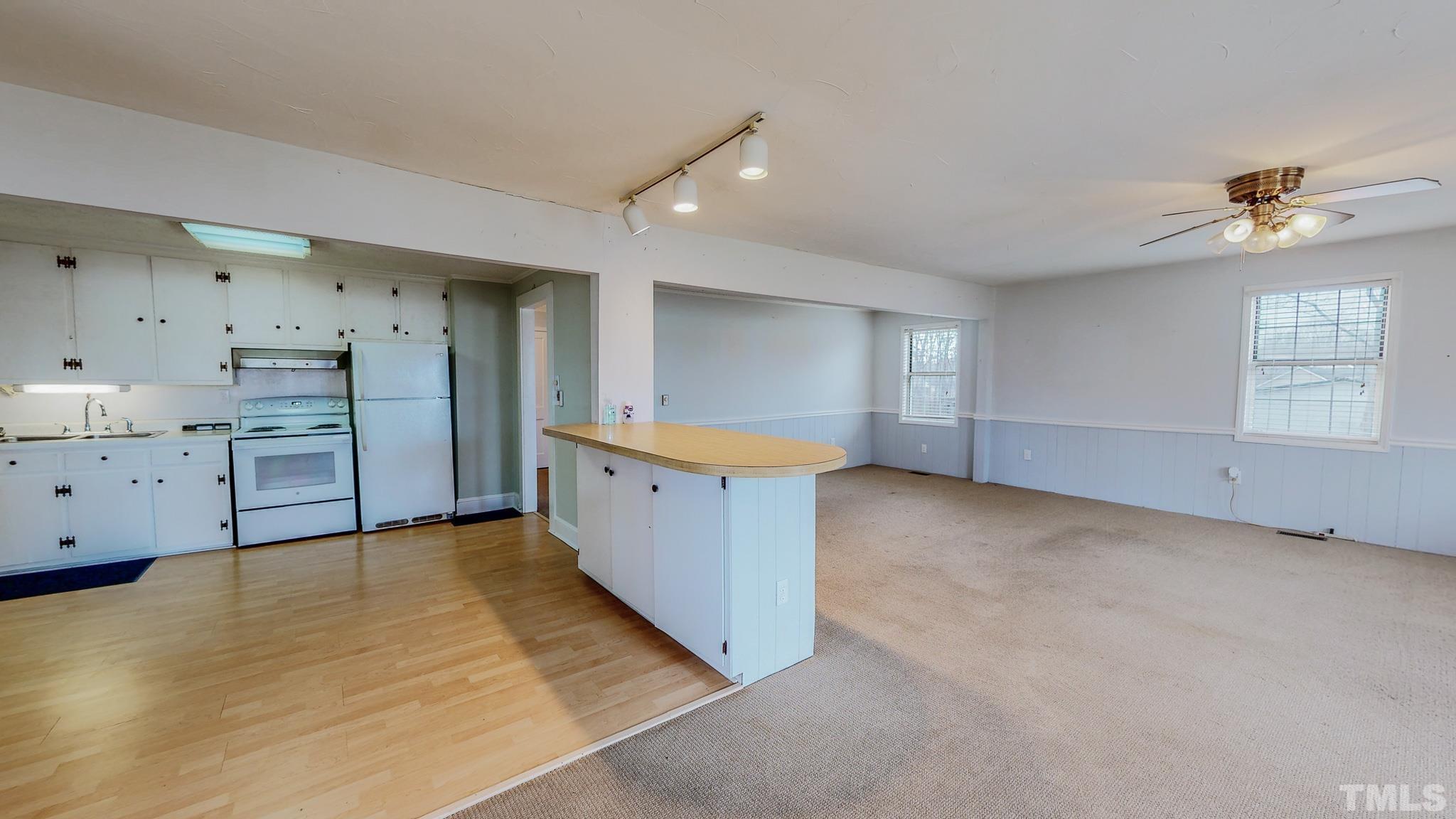 231 Patterson Drive Roxboro, NC 27573 - Photo 13 of 41 a view of a kitchen with refrigerator and cabinet