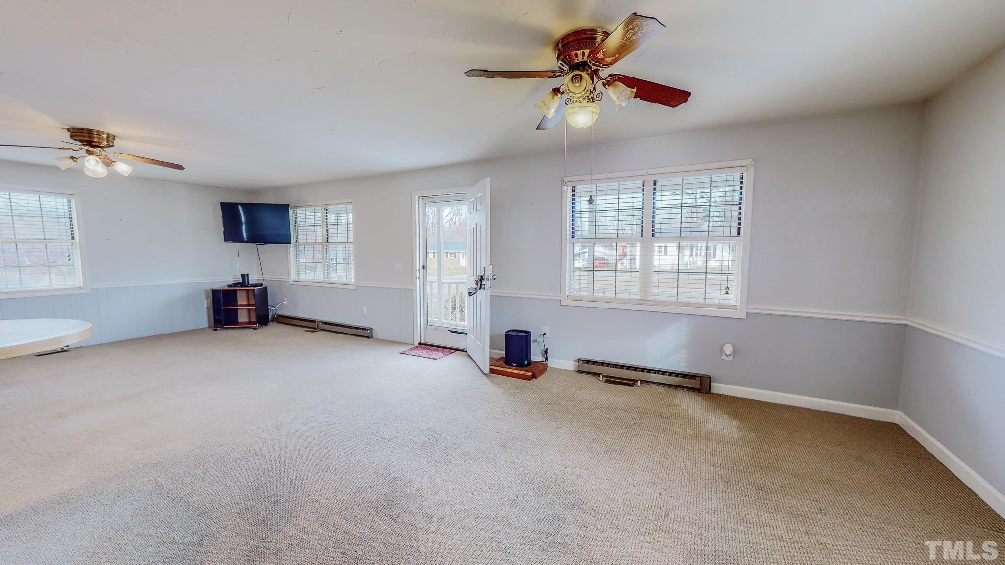 231 Patterson Drive Roxboro, NC 27573 - Photo 14 of 41 a view of a room with gym equipment and a window