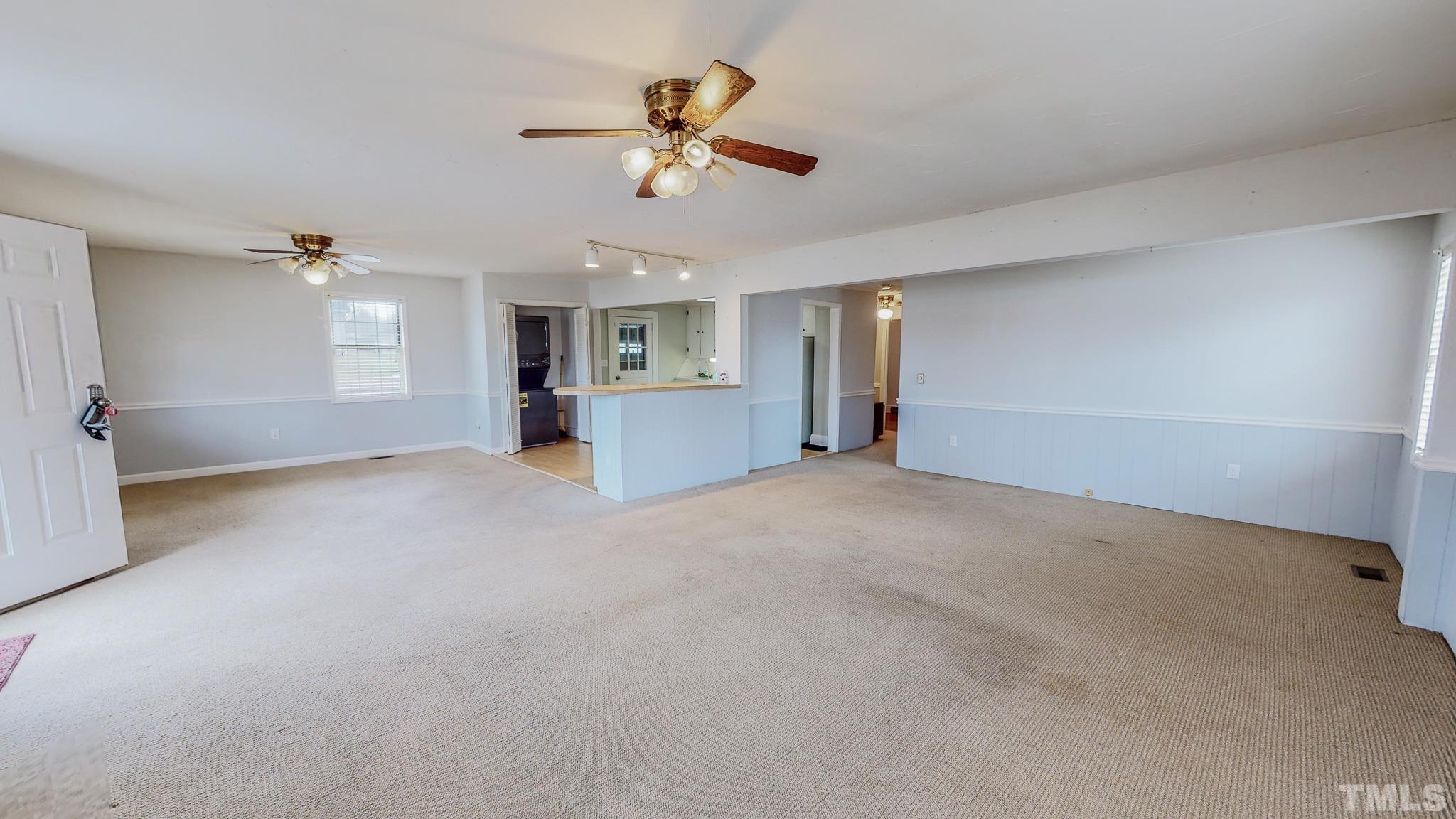 231 Patterson Drive Roxboro, NC 27573 - Photo 16 of 41 a view of a livingroom with a ceiling fan and window