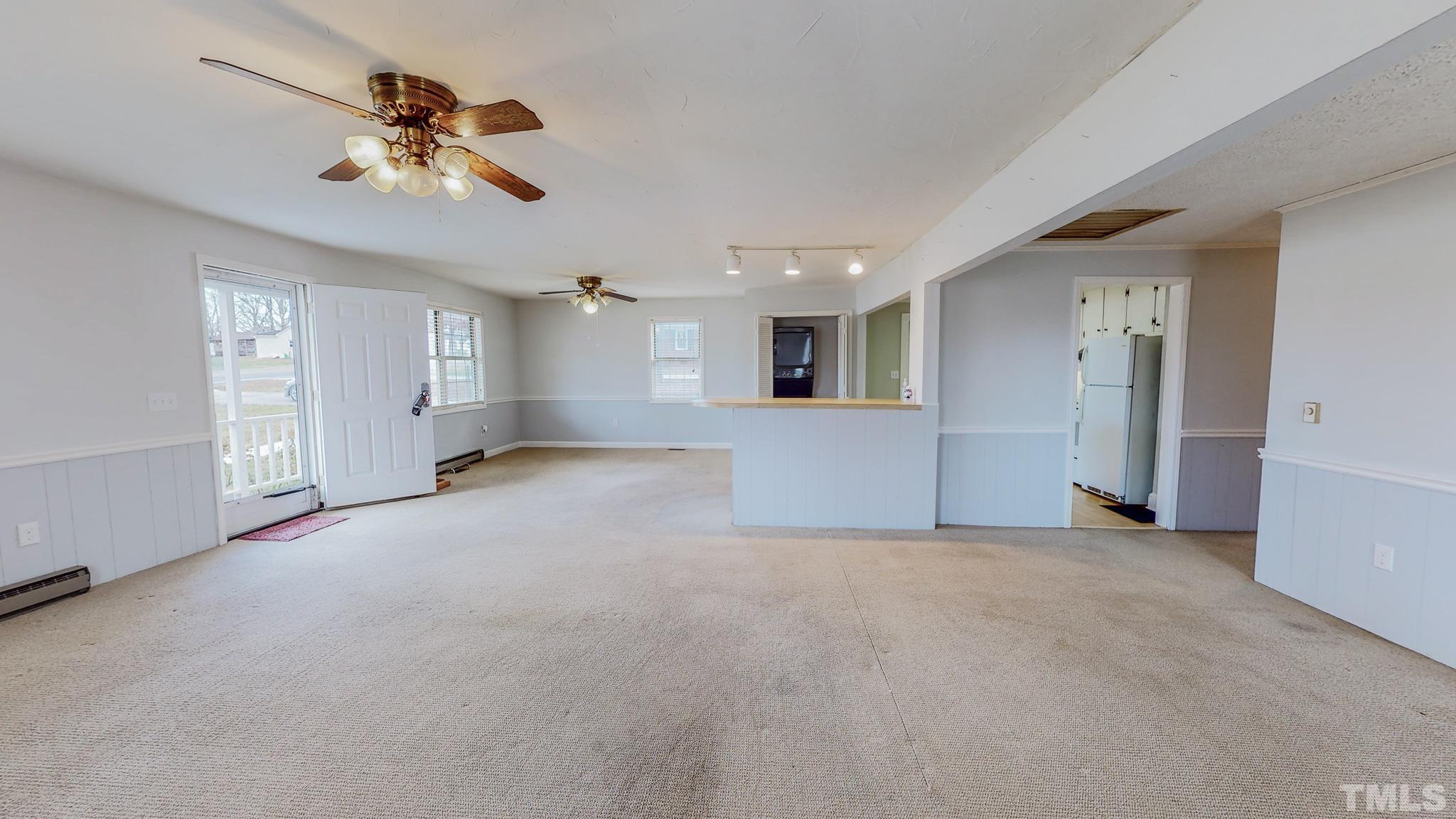 231 Patterson Drive Roxboro, NC 27573 - Photo 17 of 41 a view of a livingroom with a ceiling fan and window