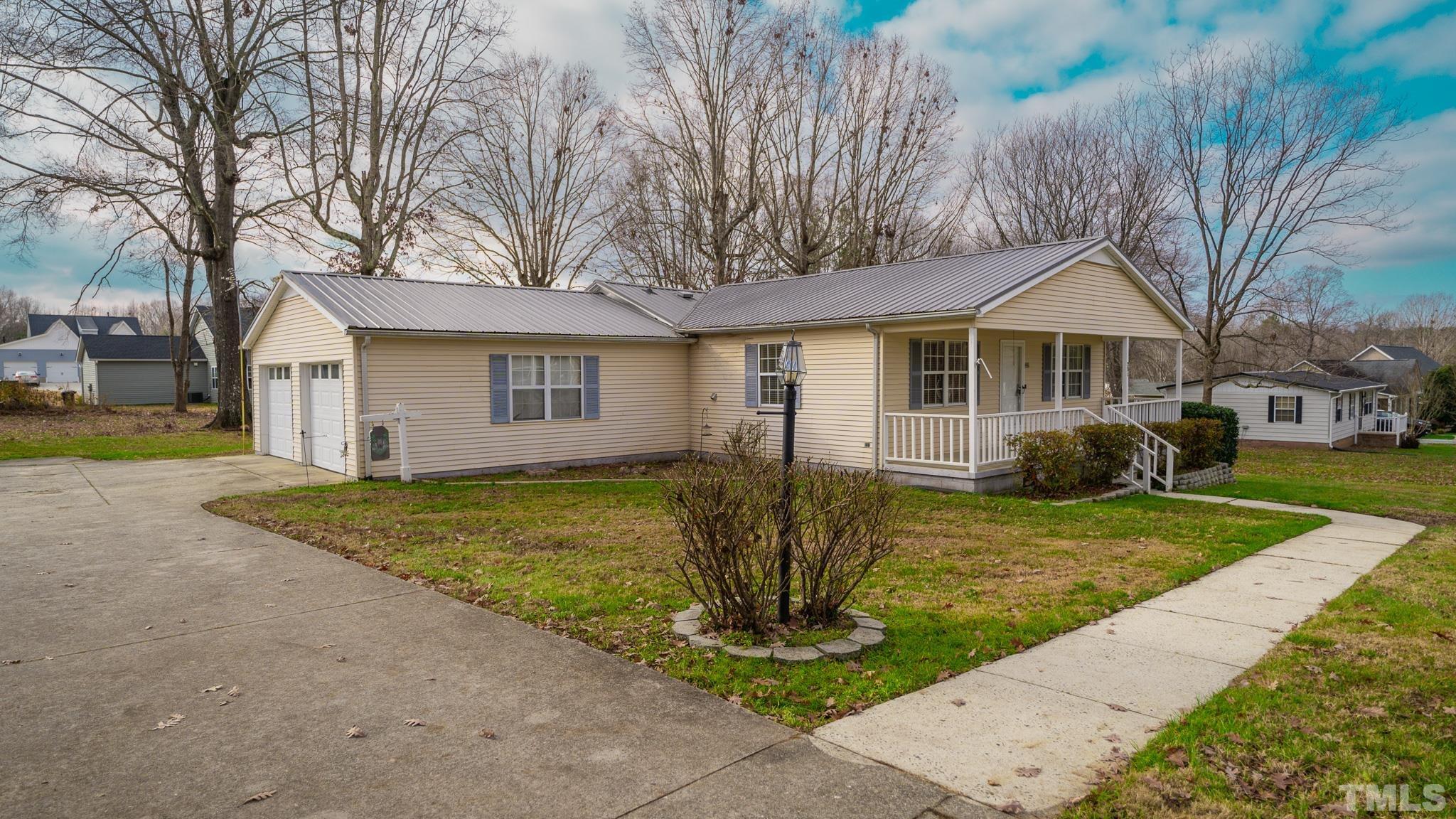 231 Patterson Drive Roxboro, NC 27573 - Photo 20 of 41 a front view of a house with garden