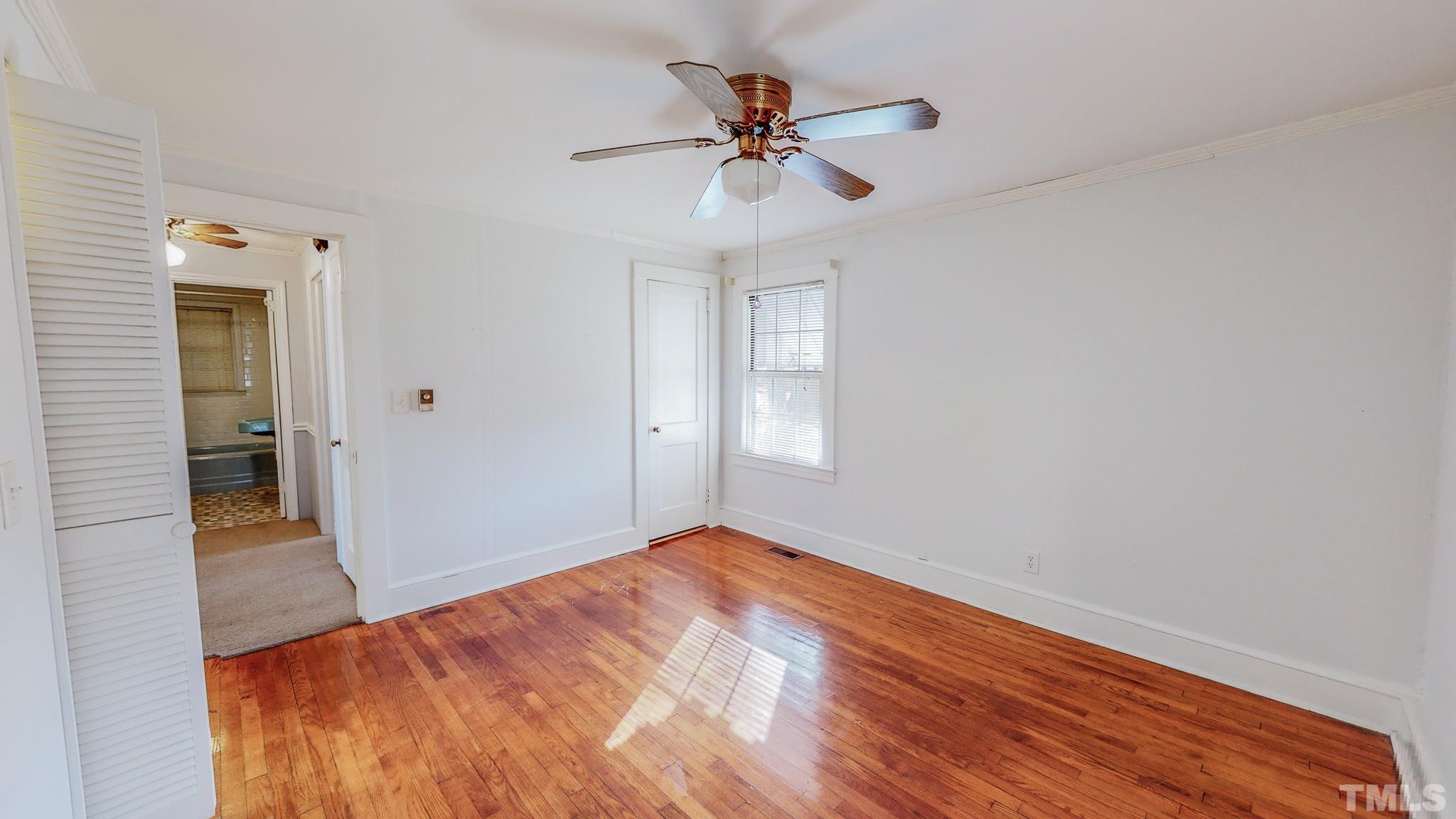 231 Patterson Drive Roxboro, NC 27573 - Photo 24 of 41 wooden floor in an empty room with a window