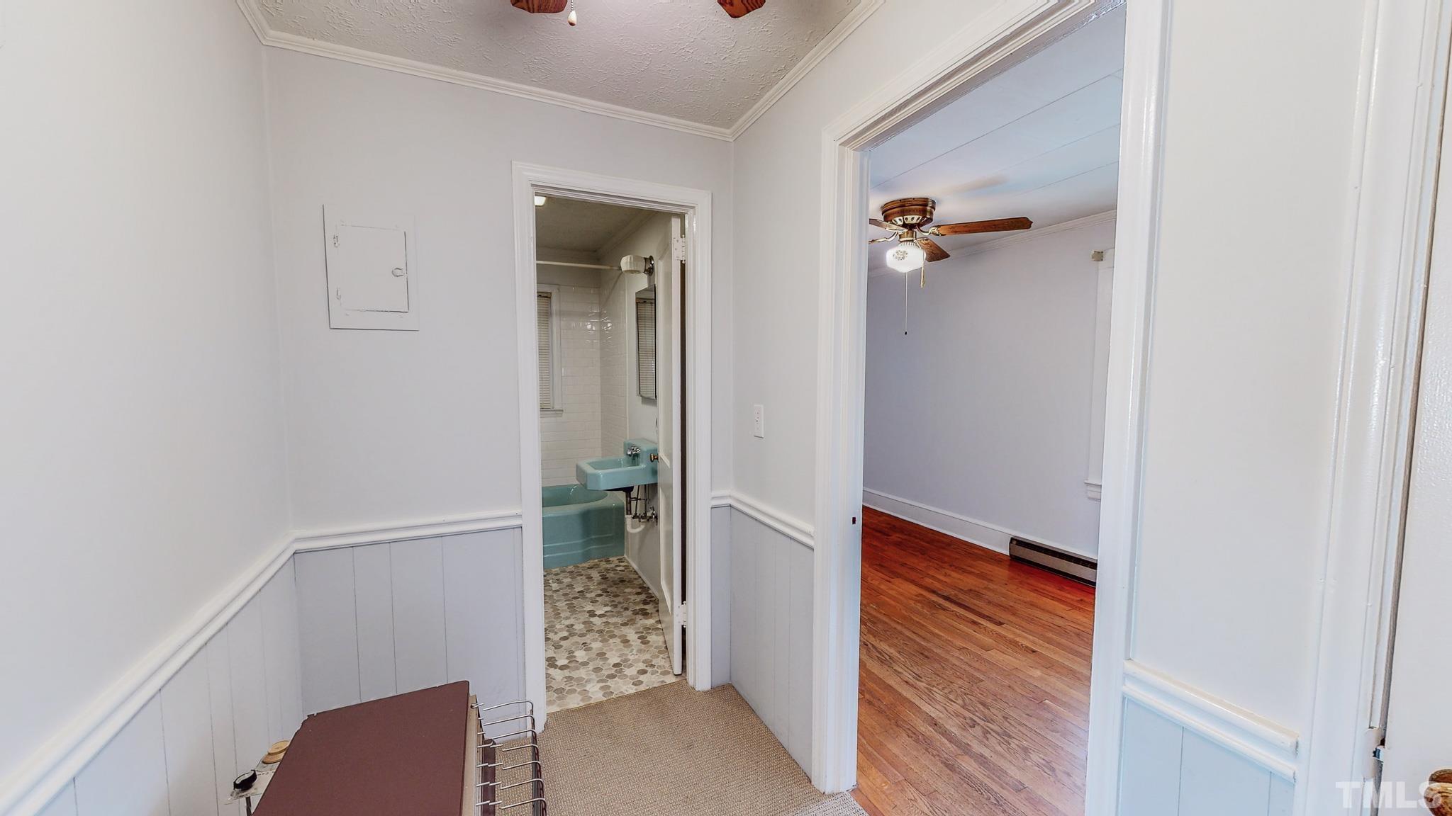 231 Patterson Drive Roxboro, NC 27573 - Photo 27 of 41 a hallway with front door wooden floor and front door
