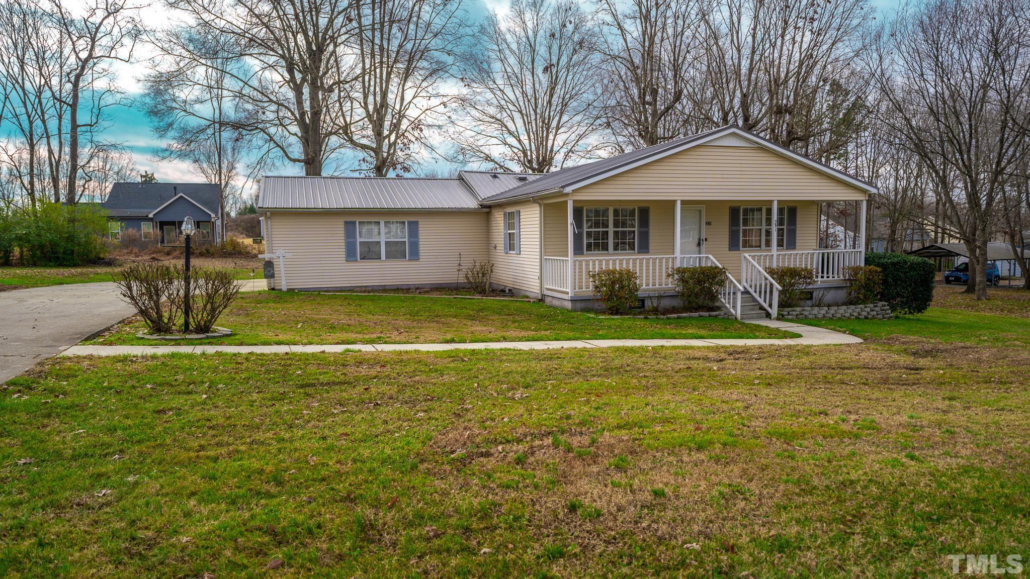 231 Patterson Drive Roxboro, NC 27573 - Photo 34 of 41 a front view of a house with a yard