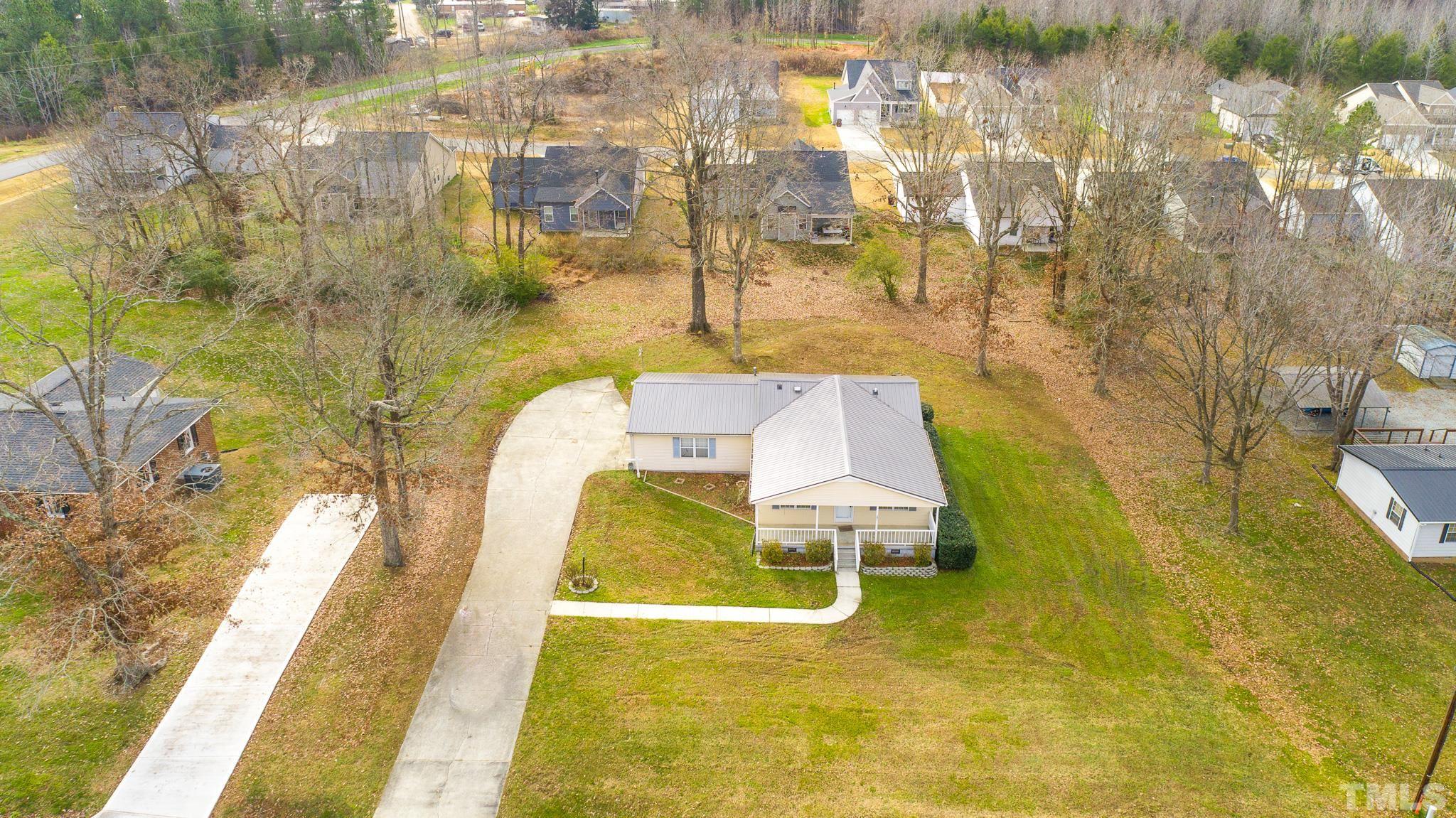 231 Patterson Drive Roxboro, NC 27573 - Photo 35 of 41 a swimming pool with dining table and chair