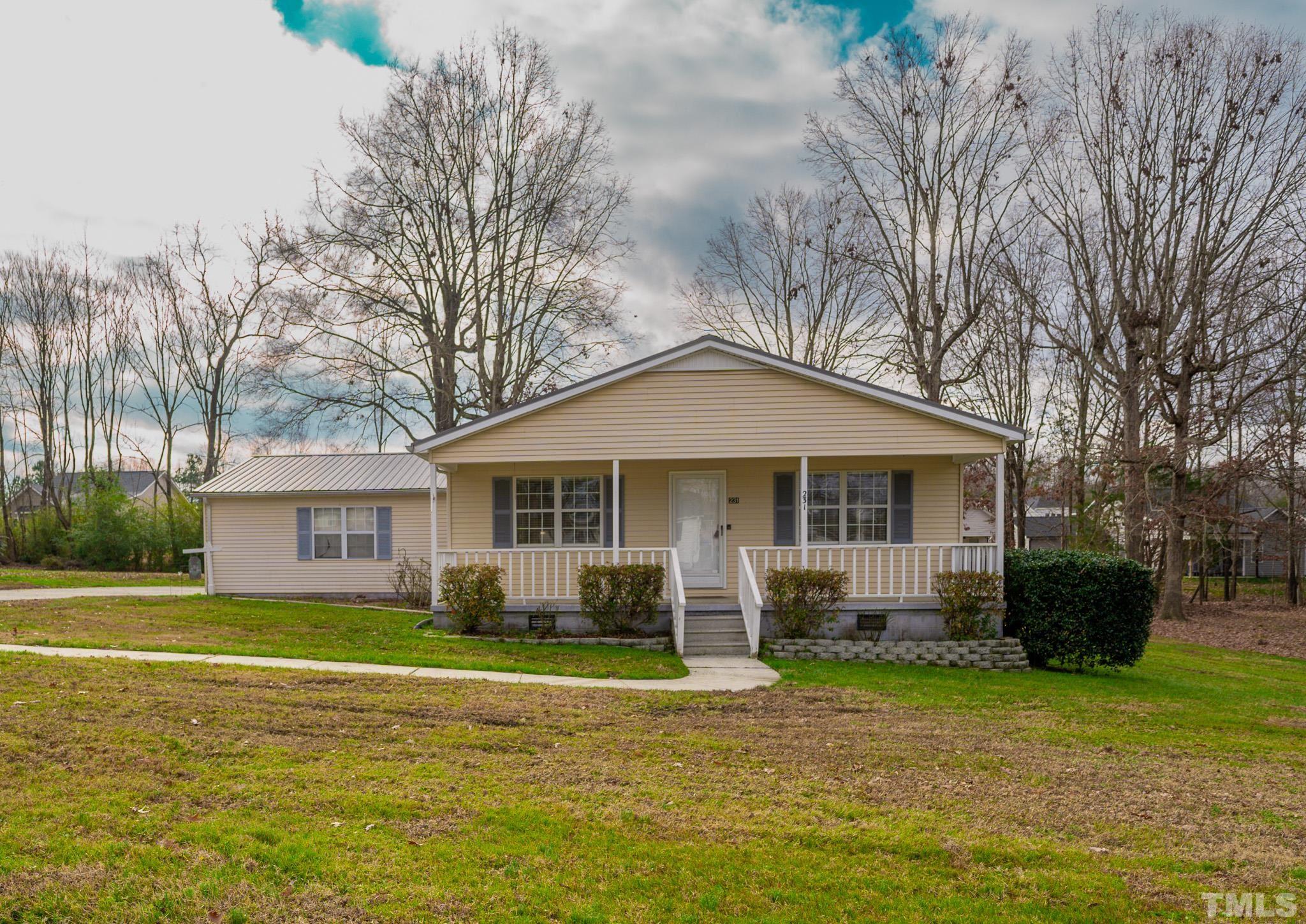 231 Patterson Drive Roxboro, NC 27573 - Photo 39 of 41 a front view of a house with a garden
