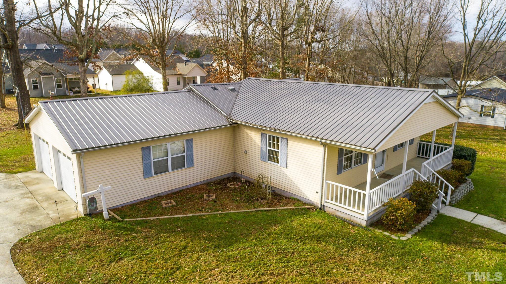 231 Patterson Drive Roxboro, NC 27573 - Photo 41 of 41 a front view of a house with a yard