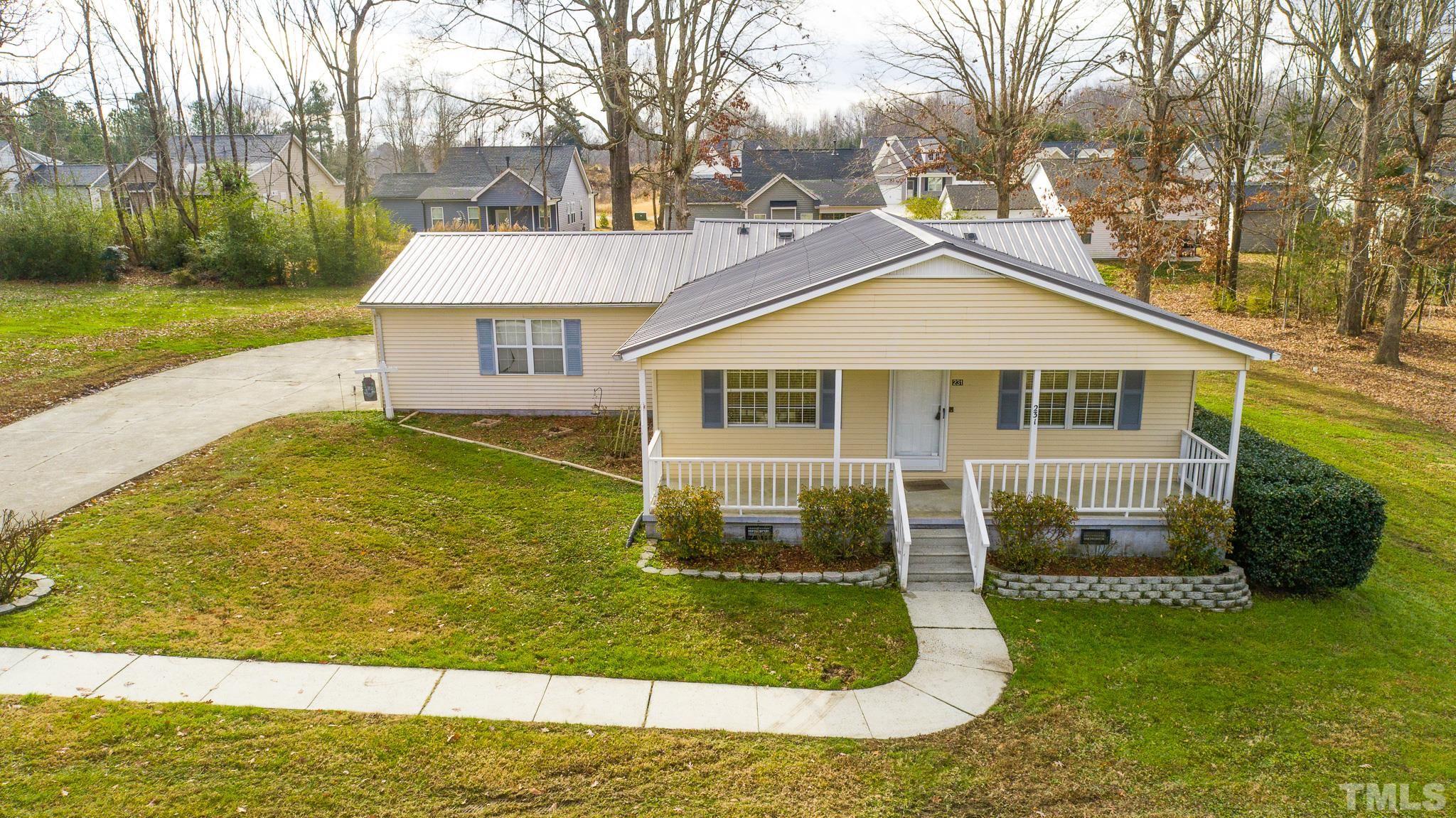 231 Patterson Drive Roxboro, NC 27573 - Photo 7 of 41 a view of a house with a yard