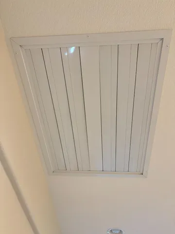 a bathroom with a shower and a toilet