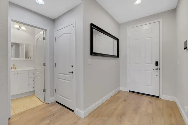 an empty room with furniture and a ceiling fan