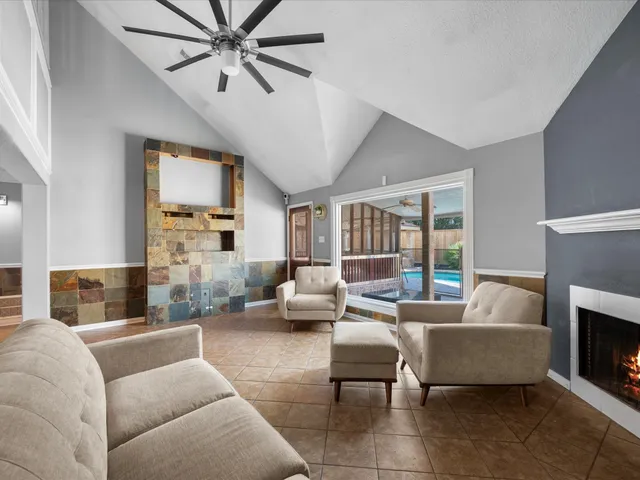 a living room with furniture and a fireplace
