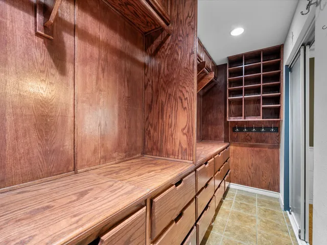 a view of balcony with wooden floor and cabinet