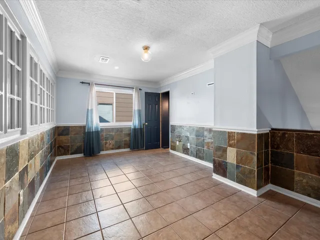 a view of entryway with a window and stairs