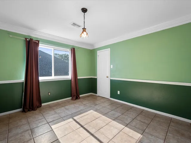 a view of a livingroom with wooden floor and a window