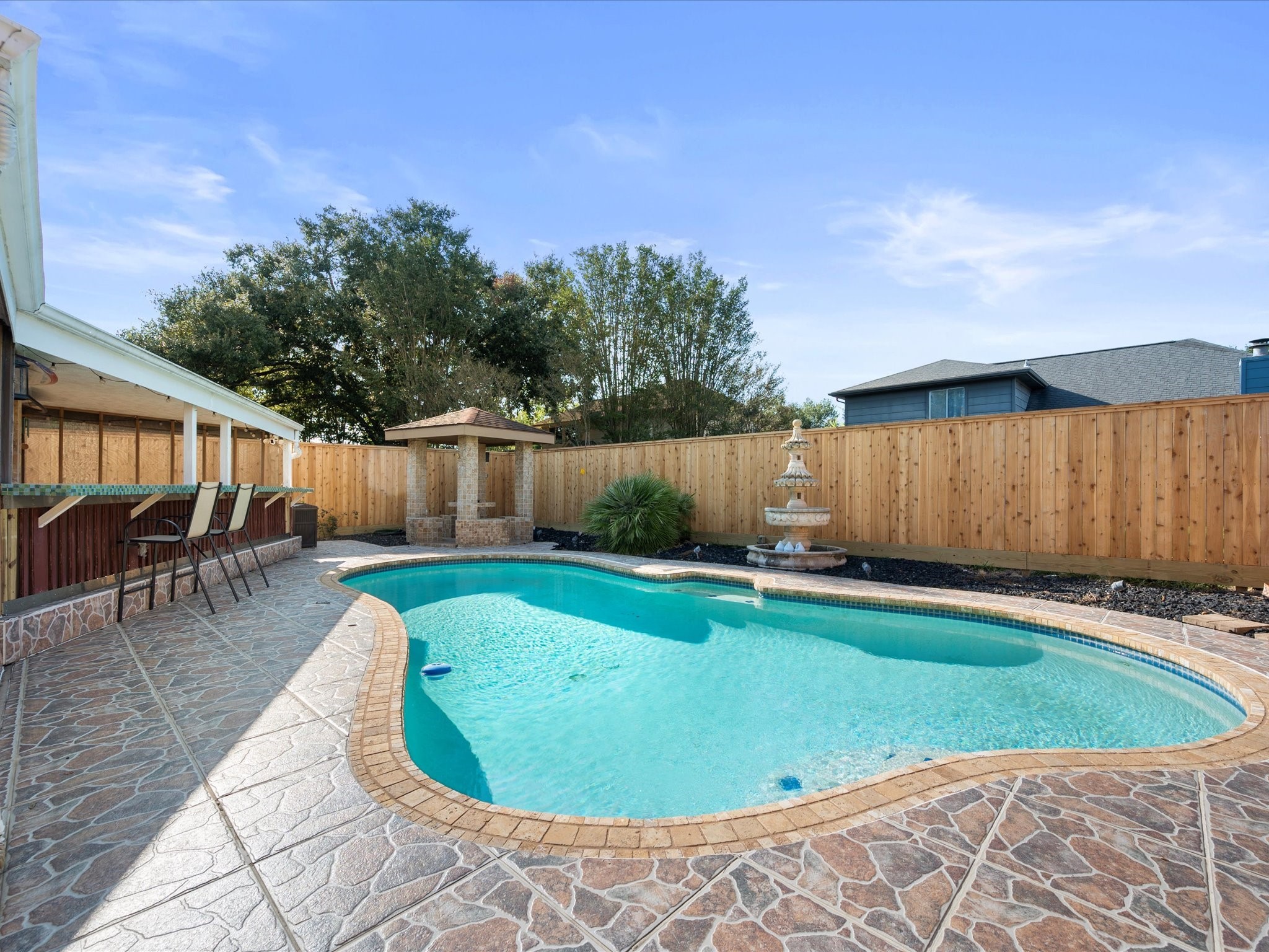 21450 Park Post Lane Katy, TX 77450 - Photo 31 of 46 a view of a swimming pool with a patio