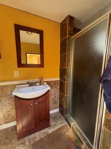 a bathroom with a sink and mirror