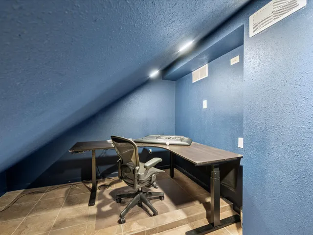 a view of a workspace with furniture