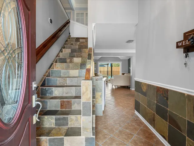 a view of staircase with white walls and windows