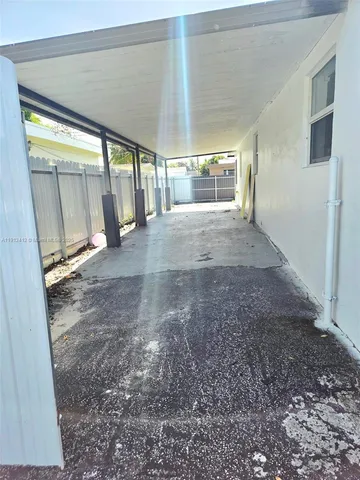 a view of empty room with floor to ceiling window