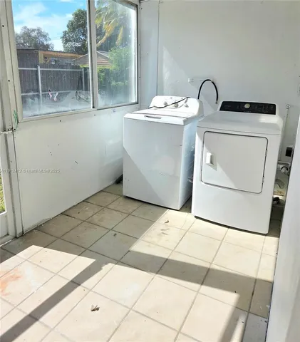 a room with washing machine and dryer