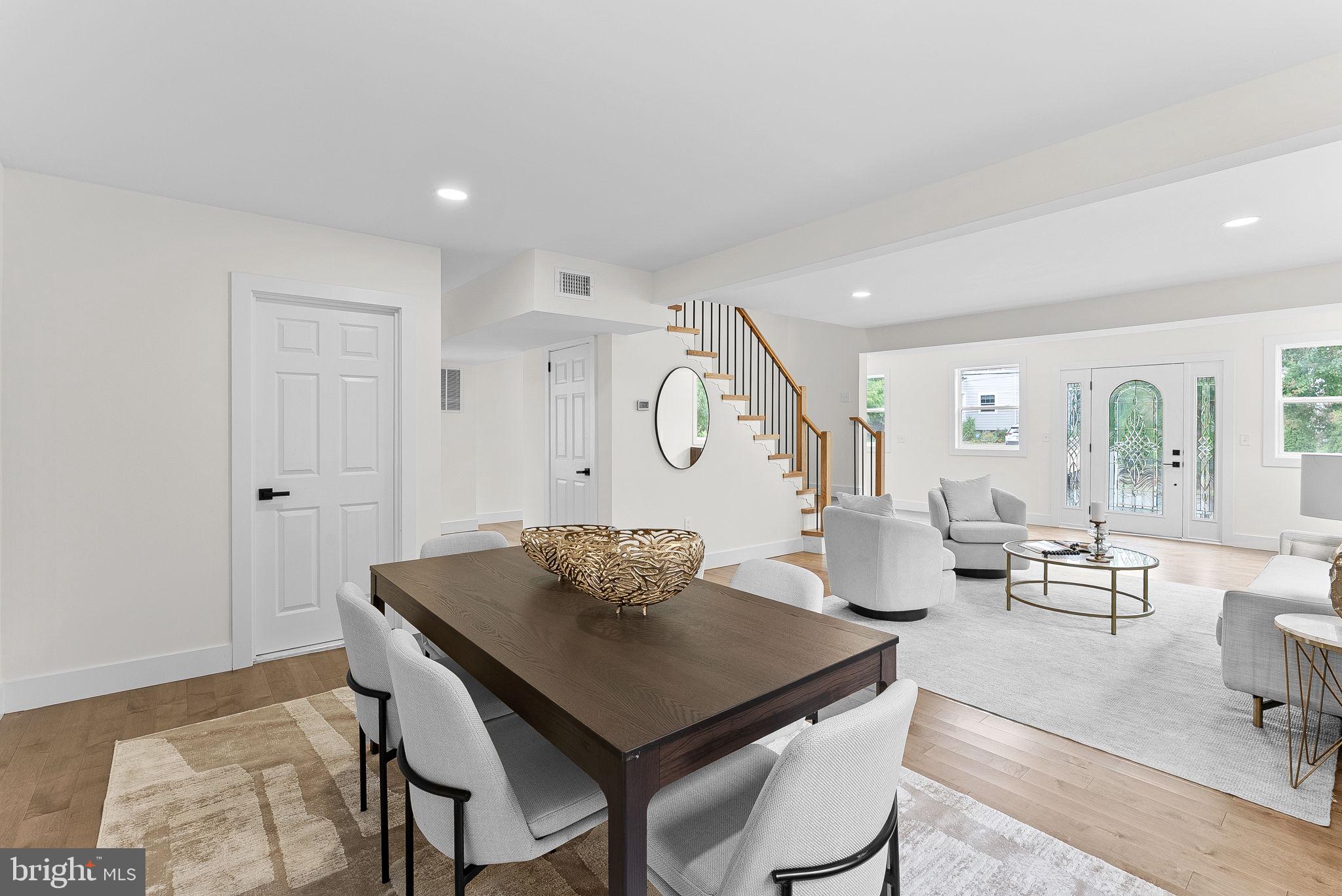 1805 South Pollard Street Arlington, VA 22204 - Photo 16 of 55 a view of a dining room and livingroom view with furniture wooden floor and a rug