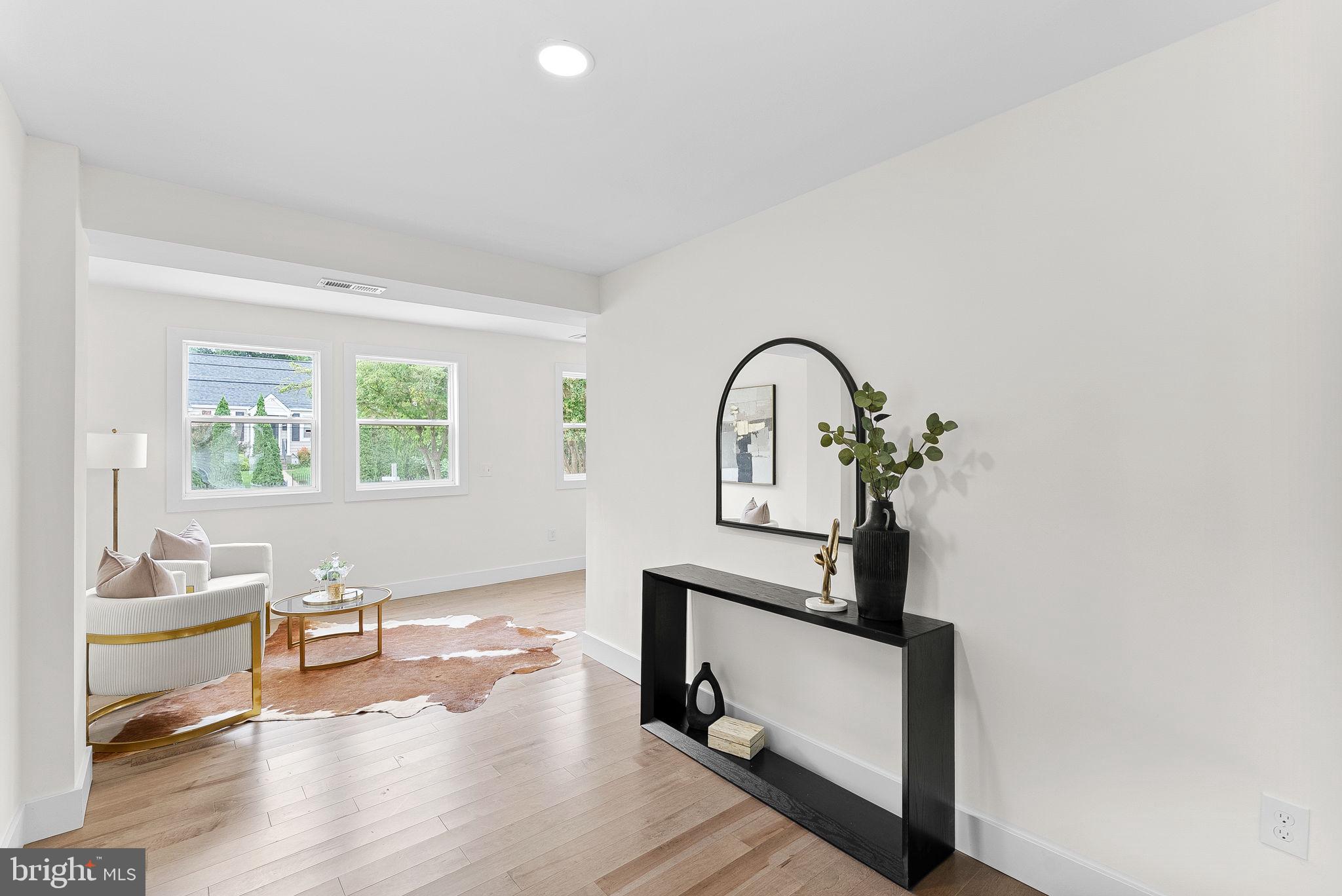 1805 South Pollard Street Arlington, VA 22204 - Photo 17 of 55 a living room with wooden floor and white walls