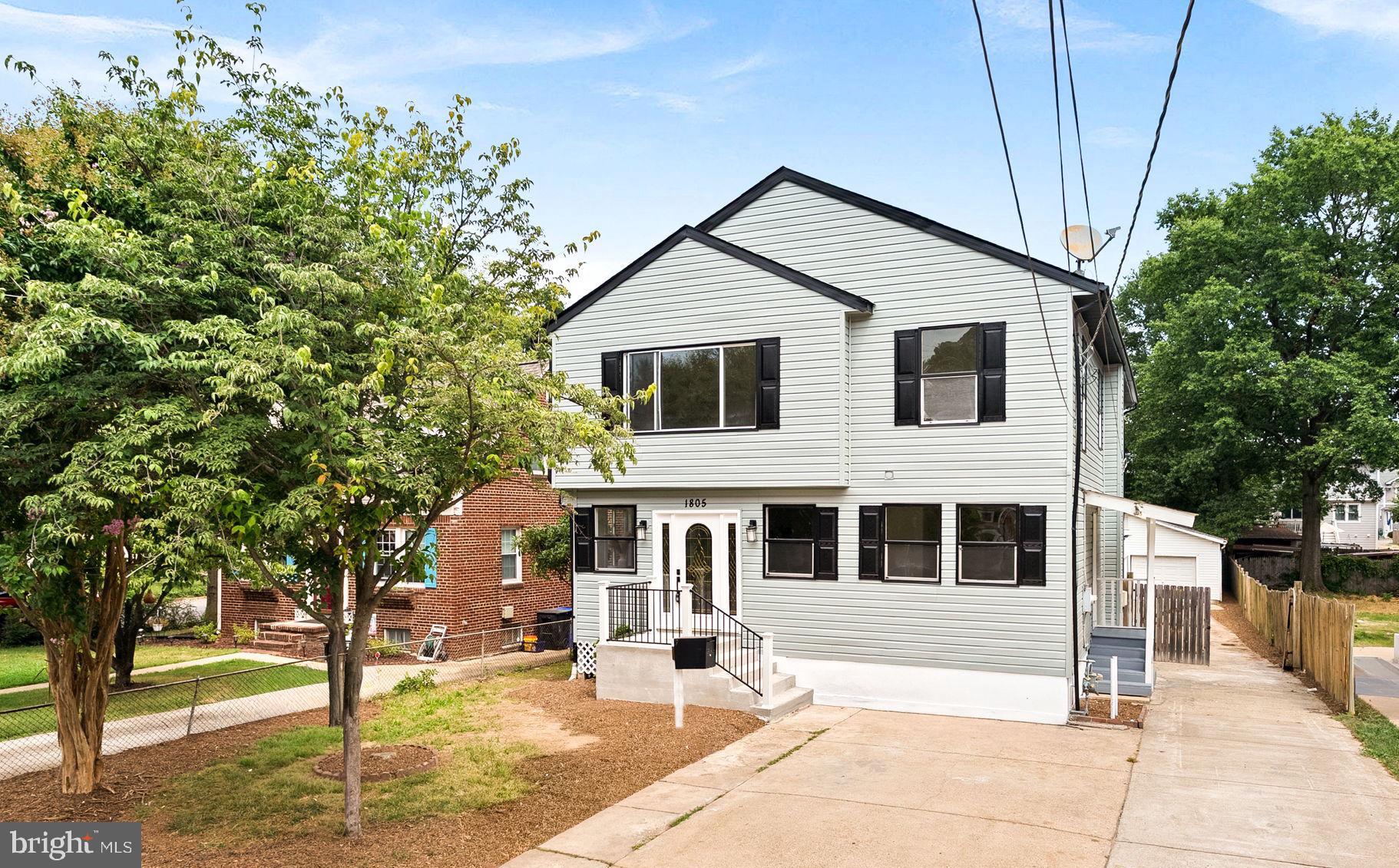 1805 South Pollard Street Arlington, VA 22204 - Photo 2 of 55 a front view of a house with a yard