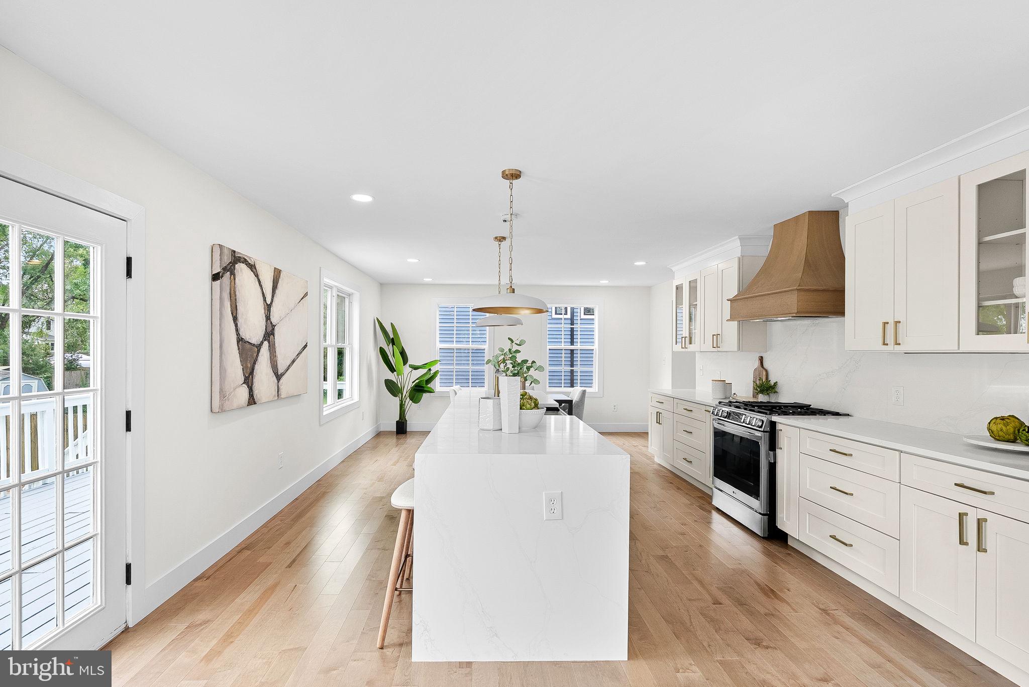1805 South Pollard Street Arlington, VA 22204 - Photo 23 of 55 a large white kitchen with wooden floors