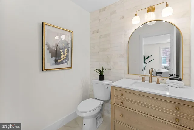 a bedroom with a bed and a table chair