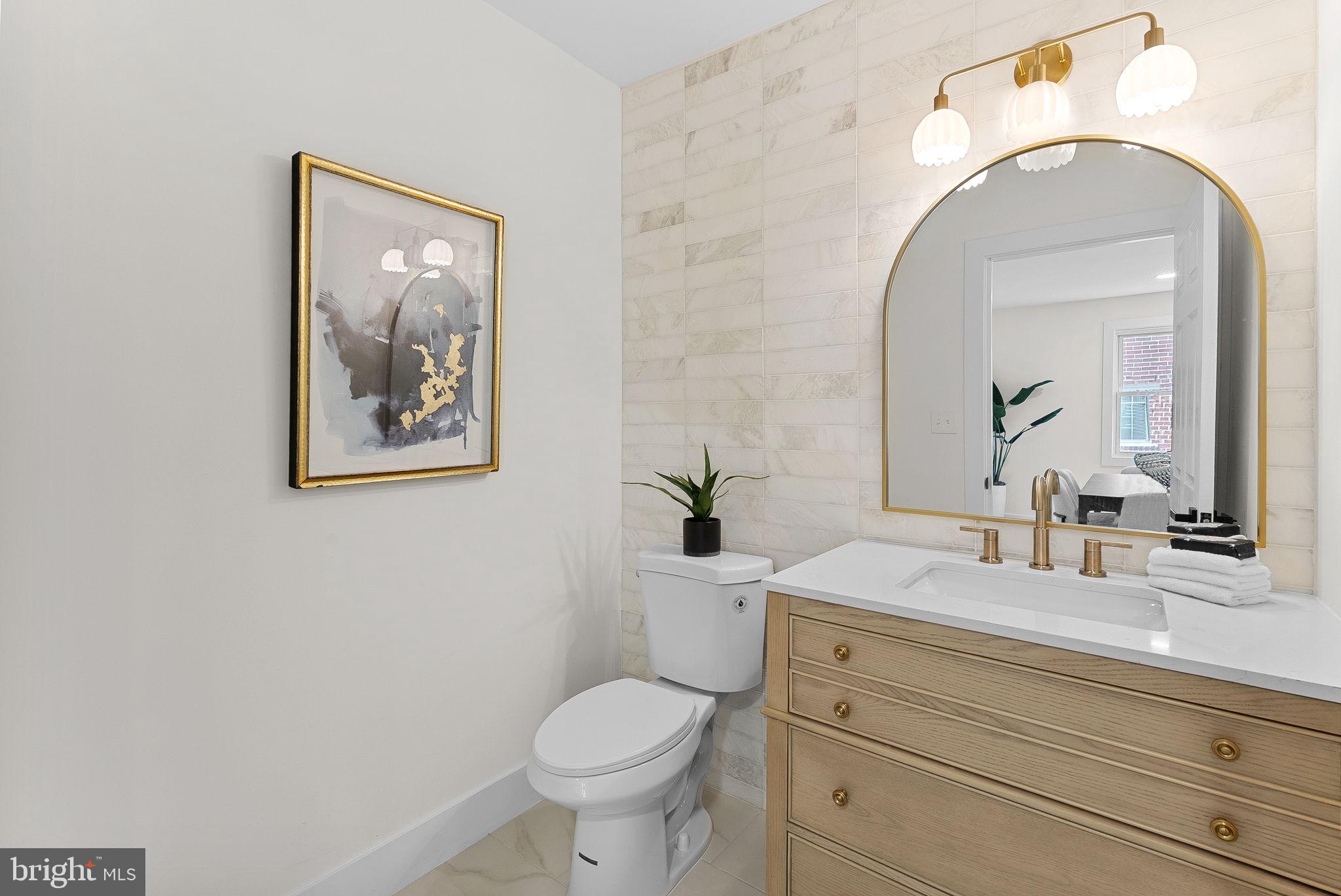 1805 South Pollard Street Arlington, VA 22204 - Photo 27 of 55 a bathroom with a toilet sink and mirror