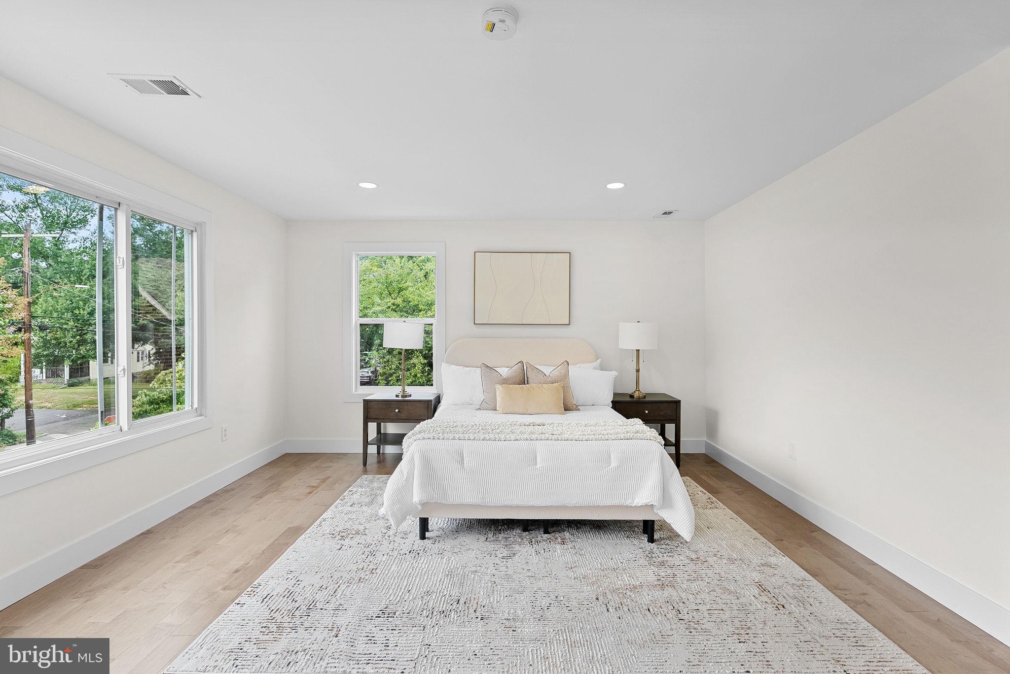 1805 South Pollard Street Arlington, VA 22204 - Photo 29 of 55 a bedroom with a bed and a large window