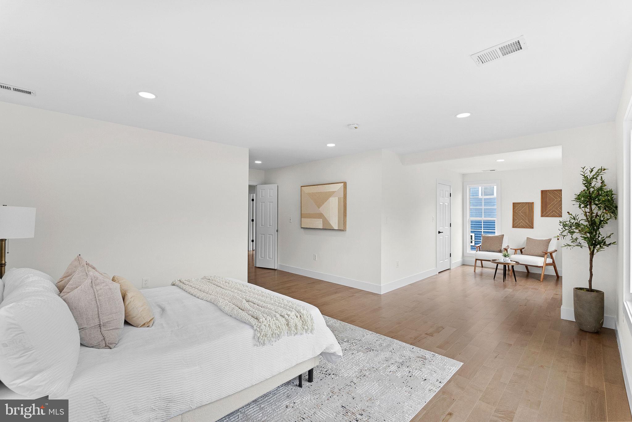 1805 South Pollard Street Arlington, VA 22204 - Photo 30 of 55 a bedroom with a bed and a table chair