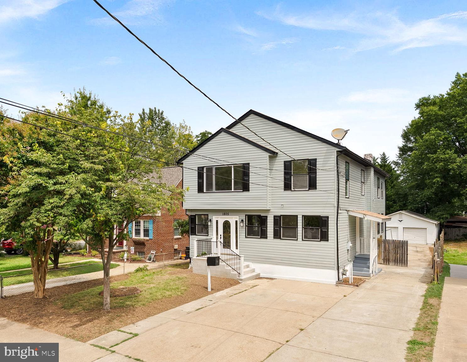 1805 South Pollard Street Arlington, VA 22204 - Photo 3 of 55 a front view of a house with a garden