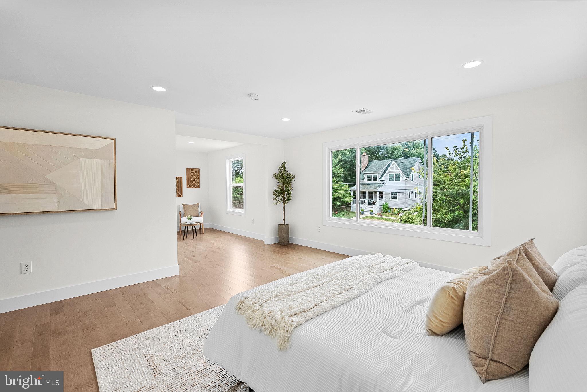 1805 South Pollard Street Arlington, VA 22204 - Photo 31 of 55 a spacious bedroom with a bed and a large window