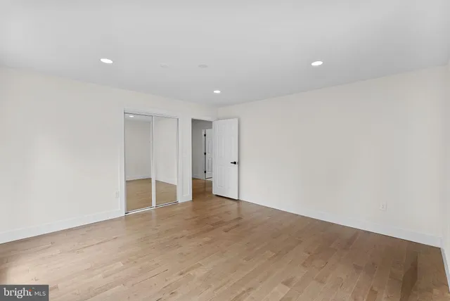 a bathroom with a granite countertop sink a toilet and a bathtub