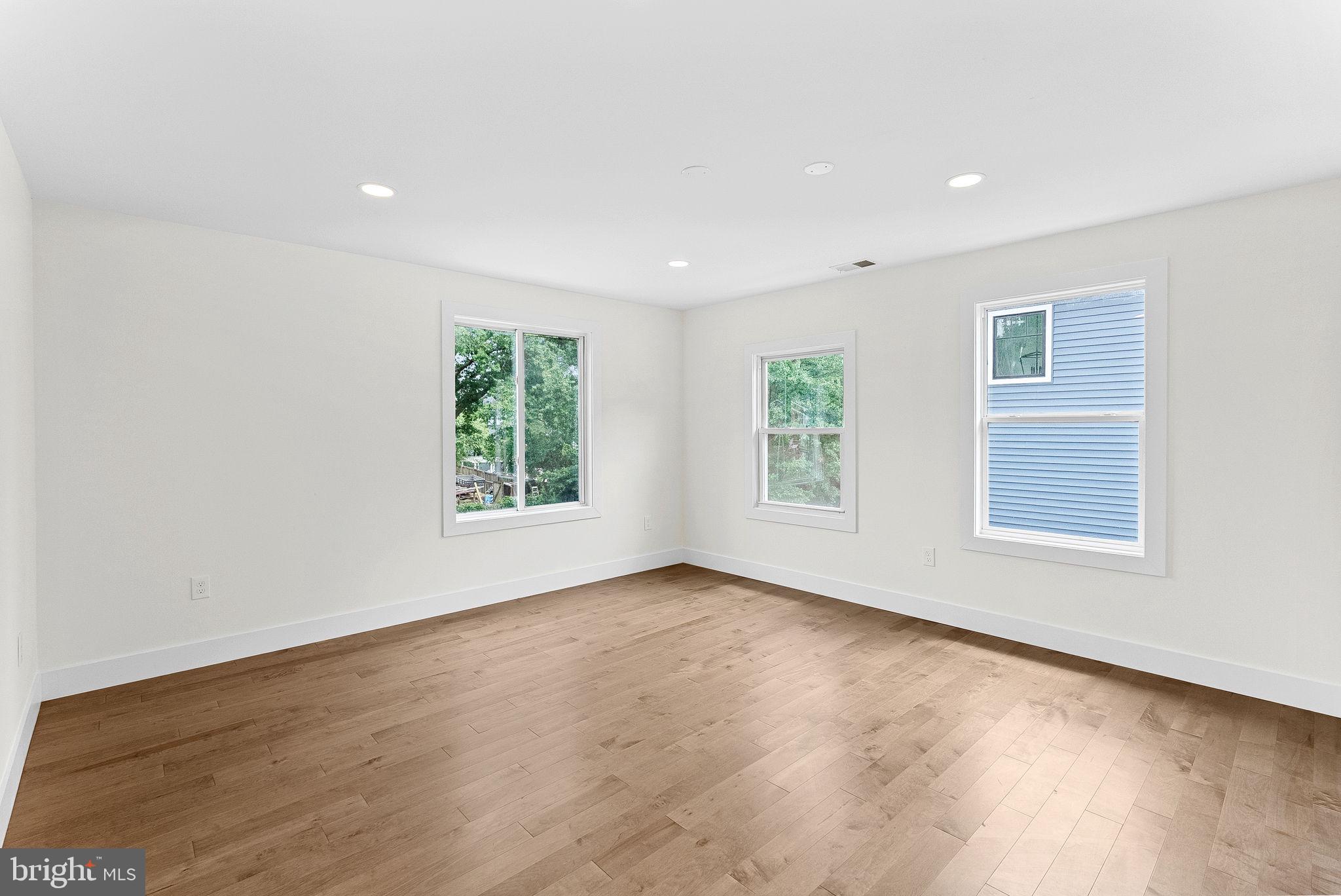 1805 South Pollard Street Arlington, VA 22204 - Photo 41 of 55 an empty room with wooden floor and windows