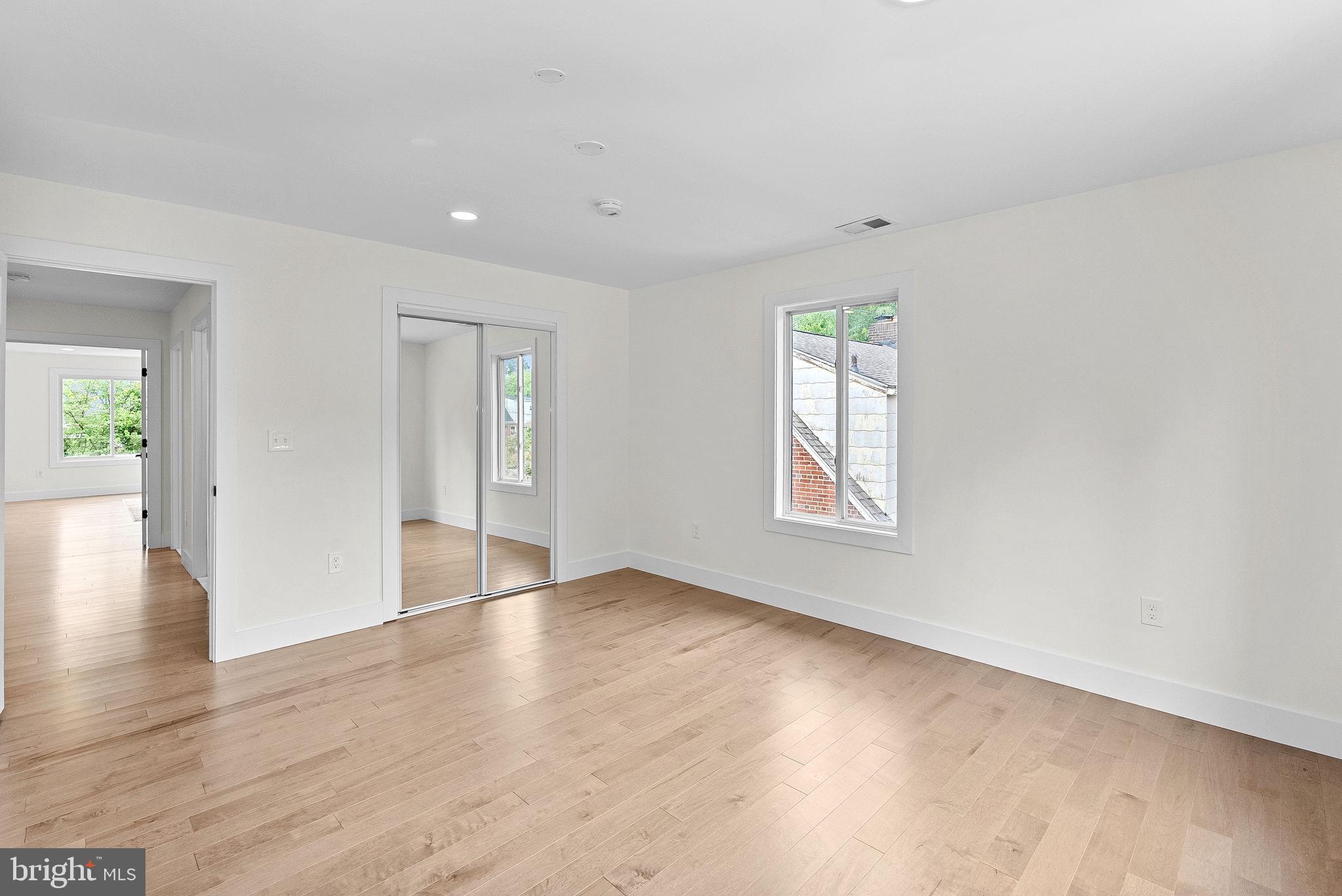 1805 South Pollard Street Arlington, VA 22204 - Photo 42 of 55 an empty room with wooden floor and windows